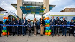 Cincinnati officals pose at a ribbon cutting. Cincinnati officals pose at a ribbon cutting.