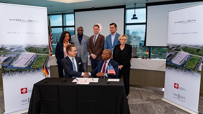 HOLON and InLight company leaders shake hands after signing the partnership agreement.