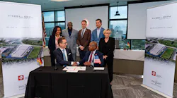 HOLON and InLight company leaders shake hands after signing the partnership agreement.