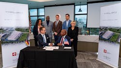 HOLON and InLight company leaders shake hands after signing the partnership agreement. HOLON and InLight company leaders shake hands after signing the partnership agreement.