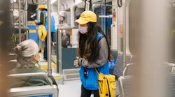 sound transit safety ambassador on rail vehicle interacts with rider