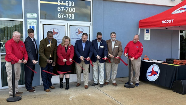 Area leaders cut the ribbon on the new management facility.