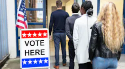 Voters wait to enter the poll.