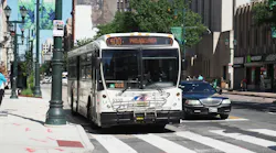 A NJ Transit bus drives down the street.