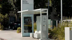 The image displays a Tolar bus shelter erected in Los Angeles.