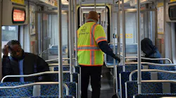 A Dallas Area Rapid Transit Clean Team member on a light-rail train.