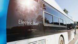 Electric vehicle bus stands at the charger. Electric vehicle bus stands at the charger.