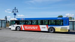 A TriMet bus approaches a stop. A TriMet bus approaches a stop.
