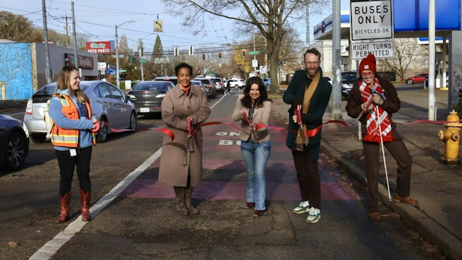 Seattle Department of Transportation Interim Director Adiam Emery, Seattle City Councilmember Alexis Mercedes Rinck, Transportation Choices Coalition Director Kirk Hovenkotter, Anna Zivarts with the Nondrivers Alliance and Seattle Department of Transportation staff cut the ribbon on the Rainier Avenue South bus lane on November 19, 2025.