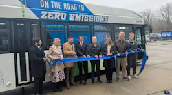 CATA and local leaders hold a ribbon for a ribbon cutting for the new bus.