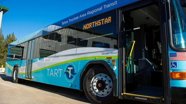 A TART bus sits with its door open.