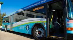A TART bus sits with its door open.