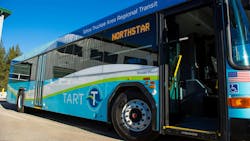 A TART bus sits with its door open. A TART bus sits with its door open.