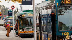 Passnegers embark King County Metro buses.