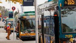 Passnegers embark King County Metro buses. Passnegers embark King County Metro buses.
