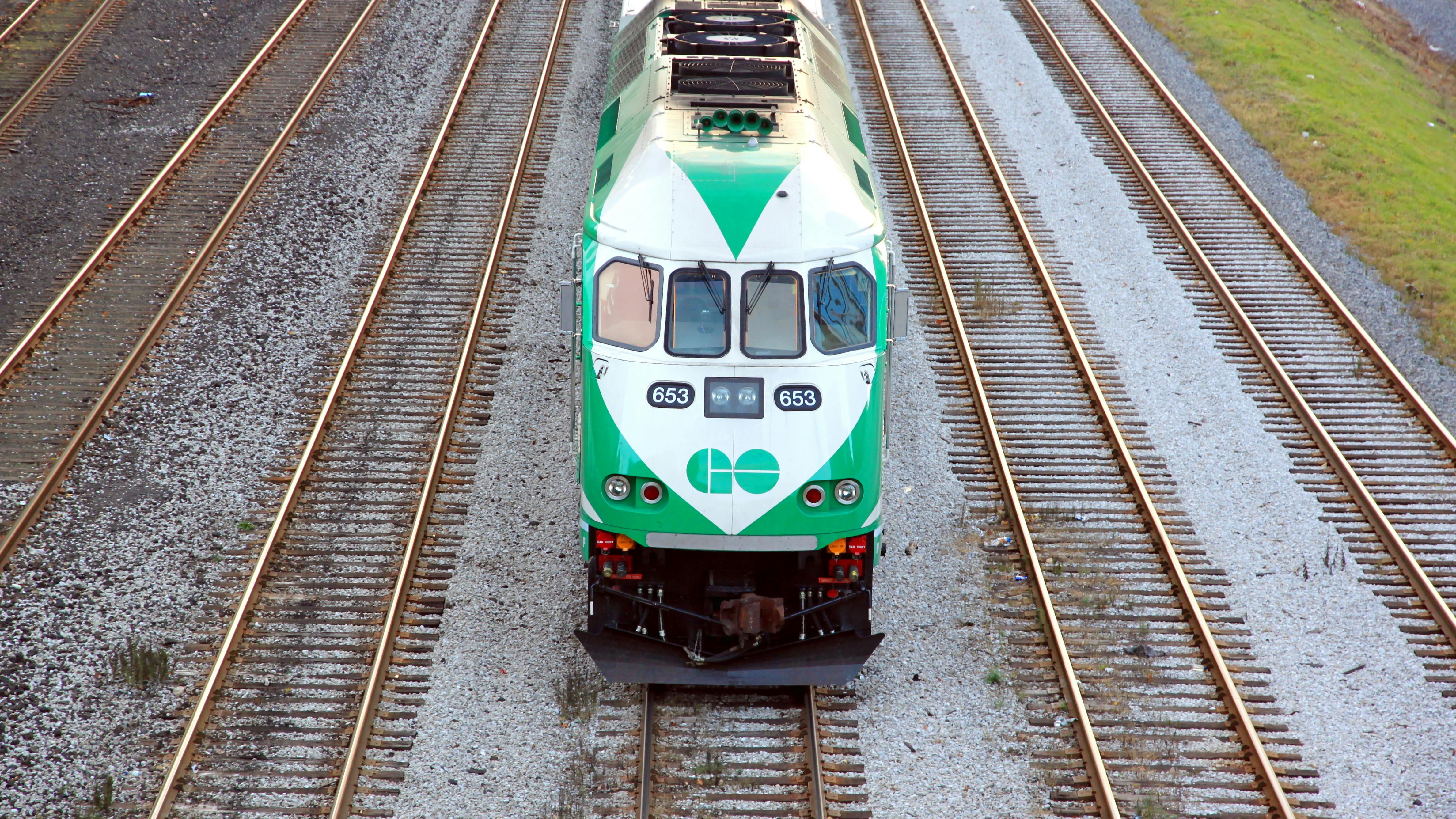 A GO Transit train moves down the track.