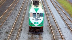 A GO Transit train moves down the track. A GO Transit train moves down the track.
