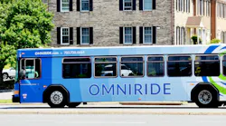 An OmniRide bus drives down the street.
