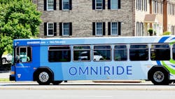 An OmniRide bus drives down the street. An OmniRide bus drives down the street.