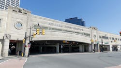 A wide shot of Newark Penn Station's street entrance. A wide shot of Newark Penn Station's street entrance.