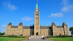 The image shows a wide shot of Canada's Parliament Hill. The image shows a wide shot of Canada's Parliament Hill.