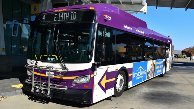 A DART bus moves down the street.