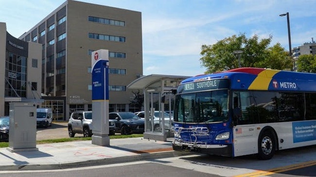 A Metro Transit bus approaches a stop.