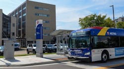 A Metro Transit bus approaches a stop. A Metro Transit bus approaches a stop.