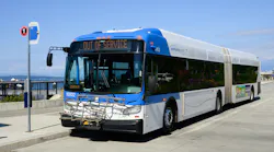 A Community Transit bus sits at a stop.