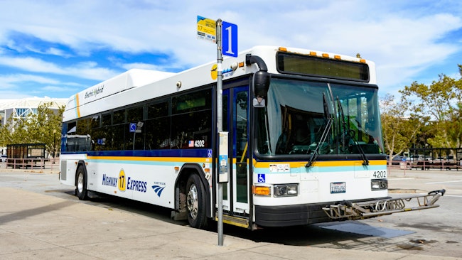 A bus sits at a San Jose stop.