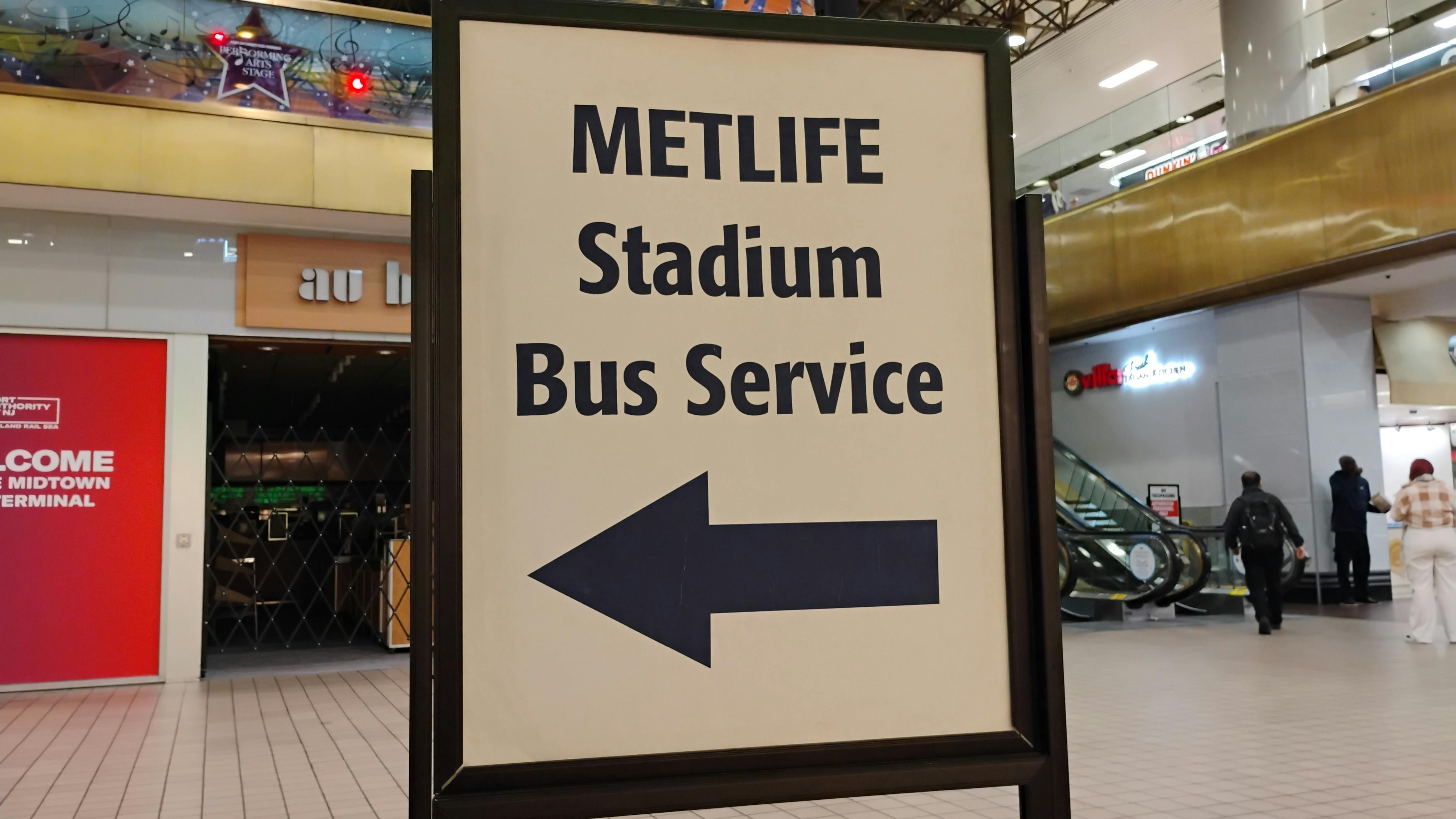 A sign indicates where riders can get bus service at MetLife stadium.