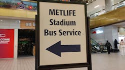 A sign indicates where riders can get bus service at MetLife stadium. A sign indicates where riders can get bus service at MetLife stadium.