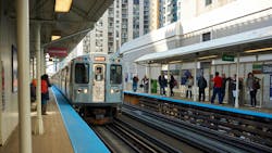 A CTA train pulled up to a station platform. A CTA train pulled up to a station platform.