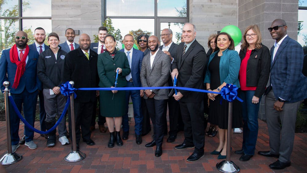 Local leaders gather to cut the ribbon on the new development.