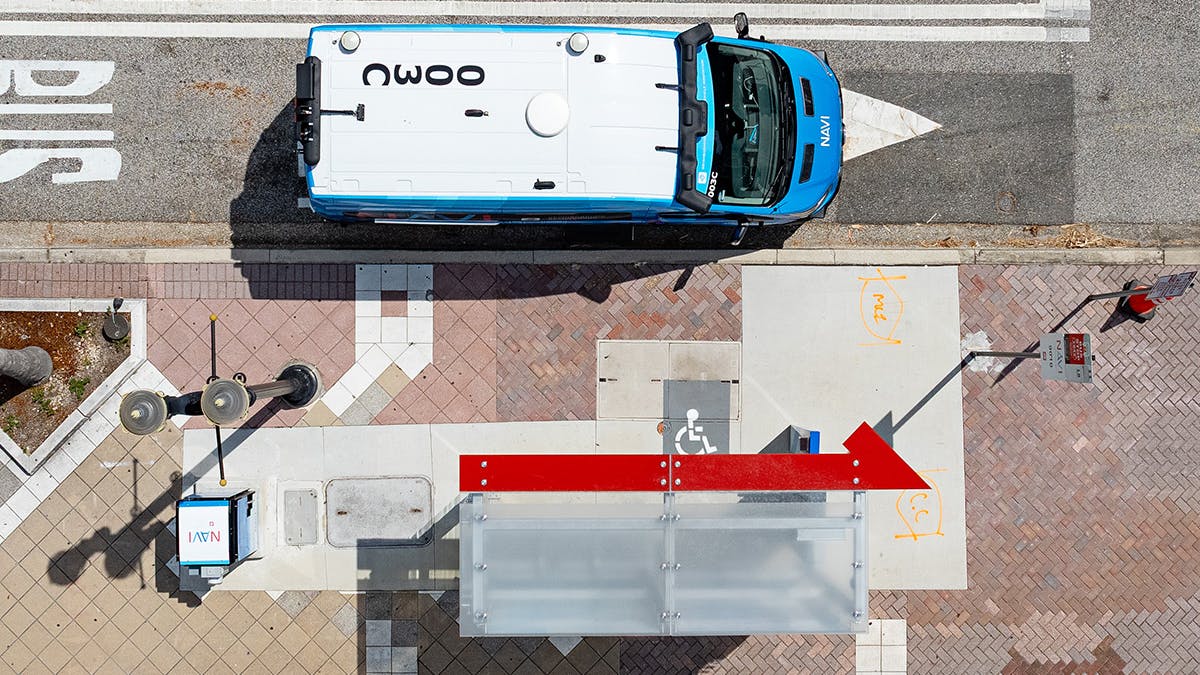 The image displays an overhead view of a NAVI autonomous vehicle.