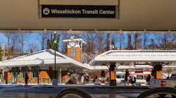 The image displays the new transit center exterior, including one of the new signs.