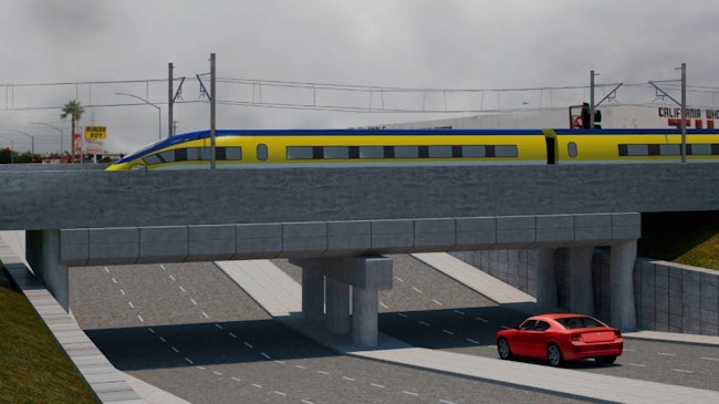 The image displays a rendering of a future grade crossing.