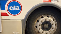 The image displays a close up shot of a wheel well of a CTA bus displaying the CTA logo. The image displays a close up shot of a wheel well of a CTA bus displaying the CTA logo.