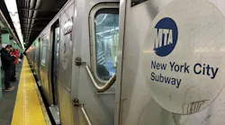 The image shows an MTA Subway logo on the side of a subway car.