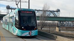 A new streetcar moves down the track. A new streetcar moves down the track.