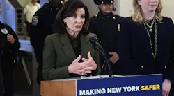 New York Gov. Kathy Hochul stands at a lectern speaking.