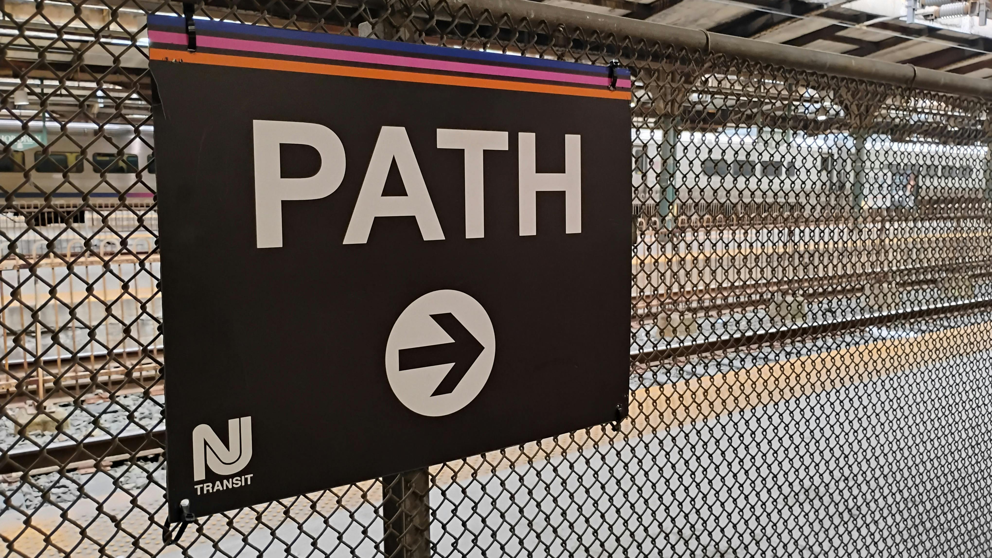 The image displays a sign for PATH train service.