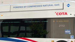 The image shows a close up shot of a COTA logo on a bus. The image shows a close up shot of a COTA logo on a bus.