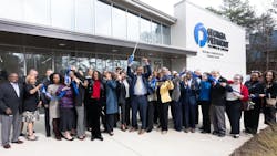 College leaders stand in front of the newly opened transit training center. College leaders stand in front of the newly opened transit training center.