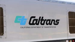 The Caltrans logo is shown on the side of a transit vehicle. The Caltrans logo is shown on the side of a transit vehicle.