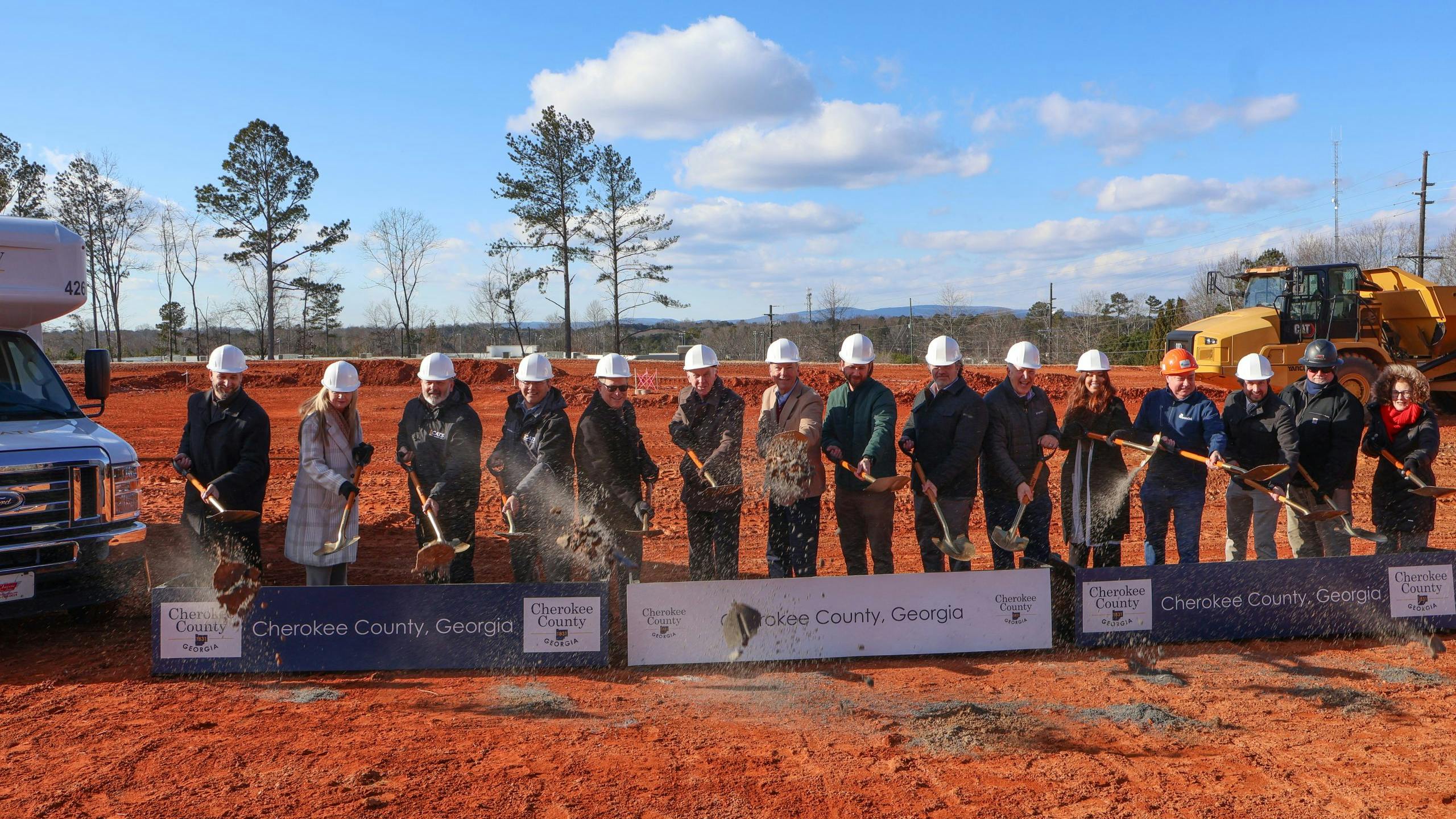 CATS and local leaders throw shovel fulls of dirt at the groundbreaking.