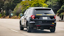 A BART PD cruiser drives away from the camera.