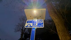 A solar light illuminates a Westchester County bus stop sign. A solar light illuminates a Westchester County bus stop sign.