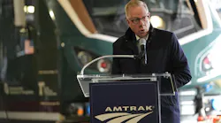 A transit leader delivers remarks in front of the new Airo train.