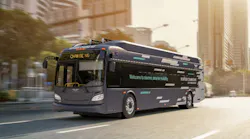 The Xcelsior CHARGE NG™ battery-electric 40-foot transit bus drives down a road.